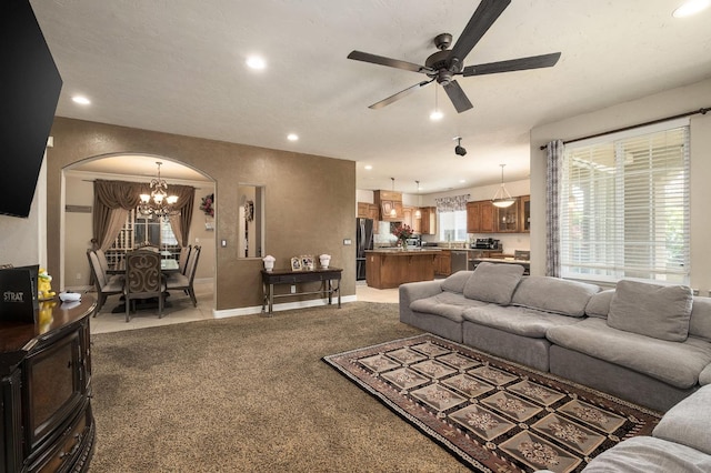 1710 N Filbert Ave, Clovis, CA 93619 - carpeted living room with a chandelier, arched walkways, a ceiling fan, recessed lighting, and baseboards