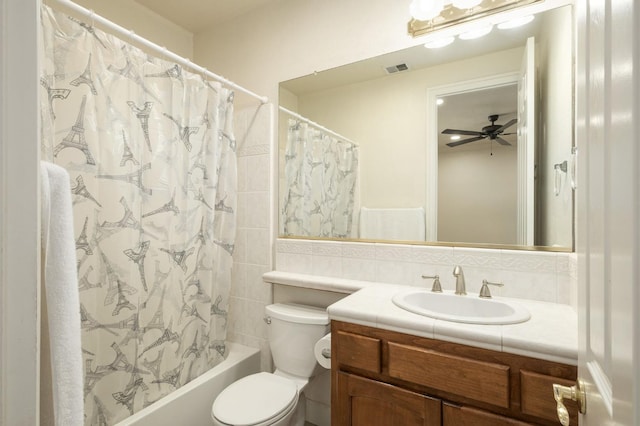1710 N Filbert Ave, Clovis, CA 93619 - full bath featuring vanity, toilet, shower / tub combo, a ceiling fan, and tile walls