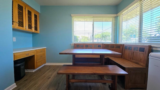 1205 Pine St, Selma, CA 93662 - dining space featuring wood finished floors, breakfast area, baseboards, and an office area