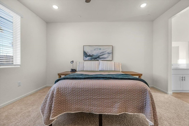 bedroom with light carpet, baseboards, and recessed lighting