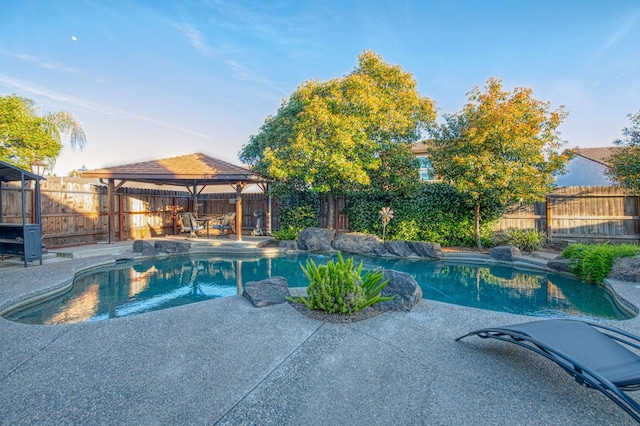 view of pool featuring a gazebo, a patio area, and a fenced backyard