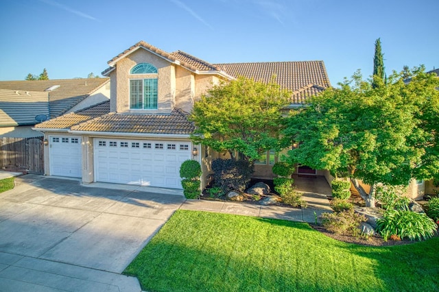 view of front facade featuring a tile roof, driveway, stucco siding, and a garage