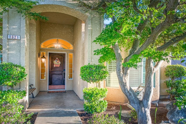 doorway to property with stucco siding