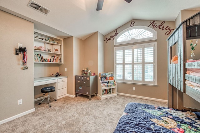 bedroom featuring lofted ceiling, carpet floors, an office area, ceiling fan, and baseboards