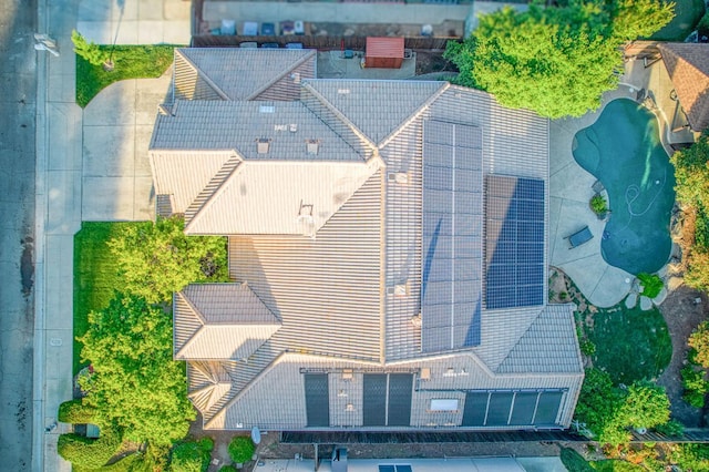 aerial view of property and surrounding area featuring a pool