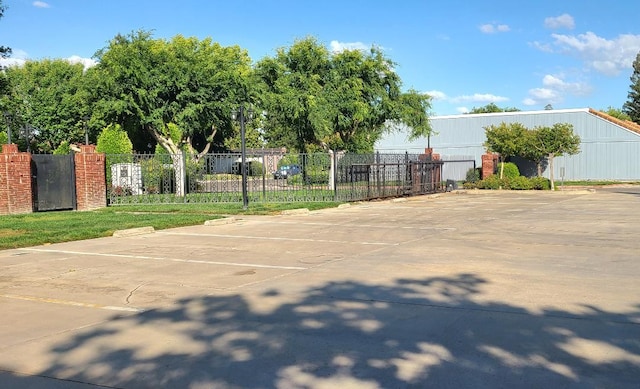 view of car parking featuring fence