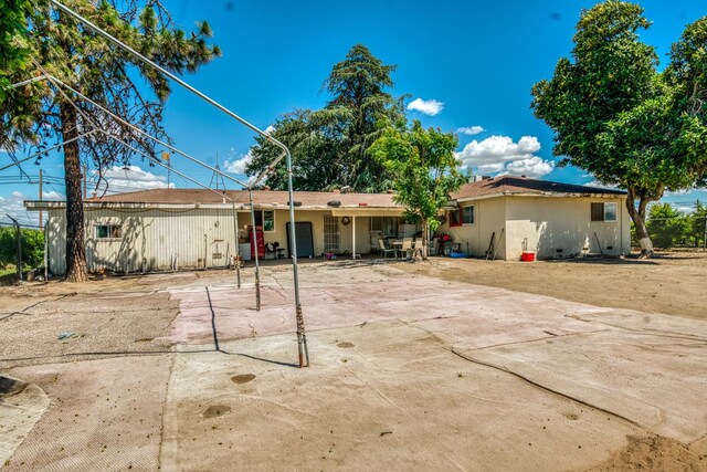 rear view of property featuring a patio