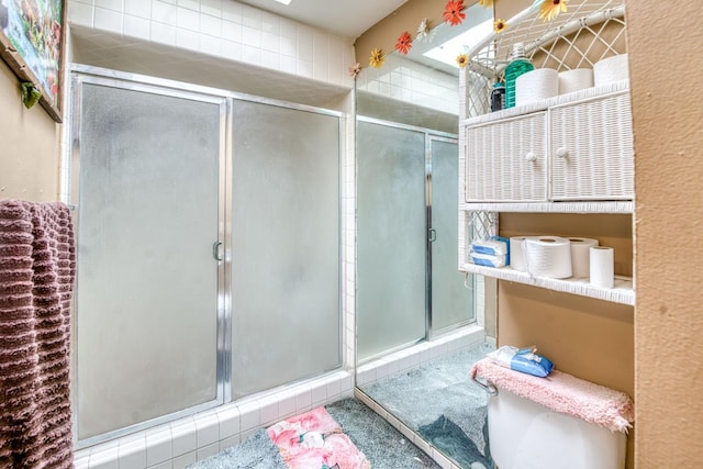 full bath with a shower stall
