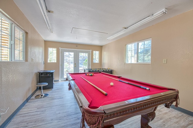 41533 Indian Rock Rd, Shaver Lake, CA 93664 - playroom featuring attic access, baseboards, wood finished floors, healthy amount of natural light, and a textured wall