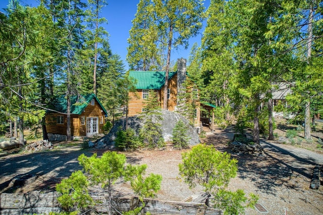 41533 Indian Rock Rd, Shaver Lake, CA 93664 - log home featuring a chimney and metal roof