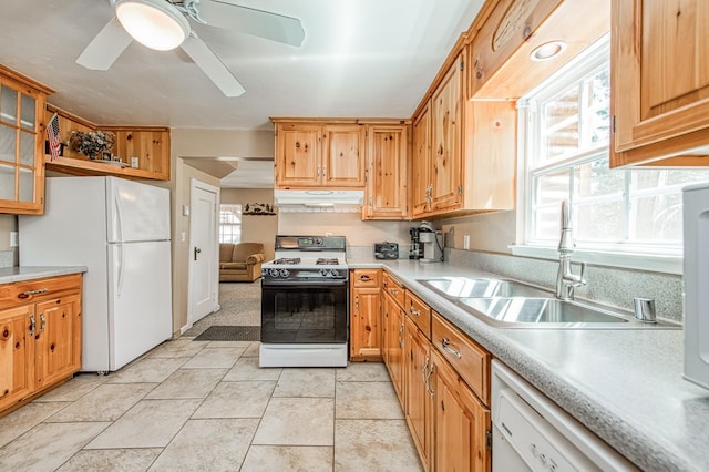41533 Indian Rock Rd, Shaver Lake, CA 93664 - kitchen featuring white appliances, a sink, light countertops, and under cabinet range hood