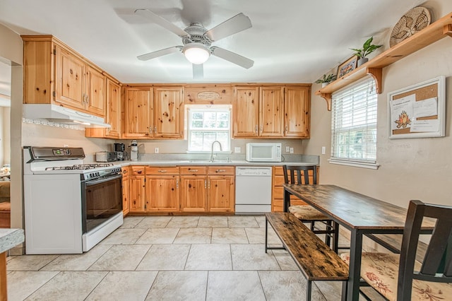 41533 Indian Rock Rd, Shaver Lake, CA 93664 - kitchen with white appliances, under cabinet range hood, a sink, light countertops, and ceiling fan