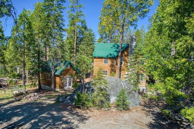 41533 Indian Rock Rd, Shaver Lake, CA 93664 - view of front of house with french doors, metal roof, and log exterior