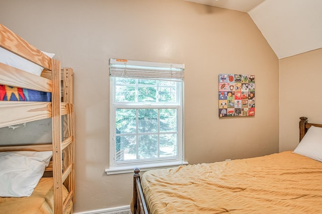 41533 Indian Rock Rd, Shaver Lake, CA 93664 - bedroom featuring multiple windows, lofted ceiling, and baseboards