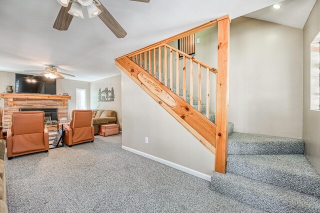 41533 Indian Rock Rd, Shaver Lake, CA 93664 - carpeted living room with ceiling fan, stairs, a brick fireplace, baseboards, and recessed lighting
