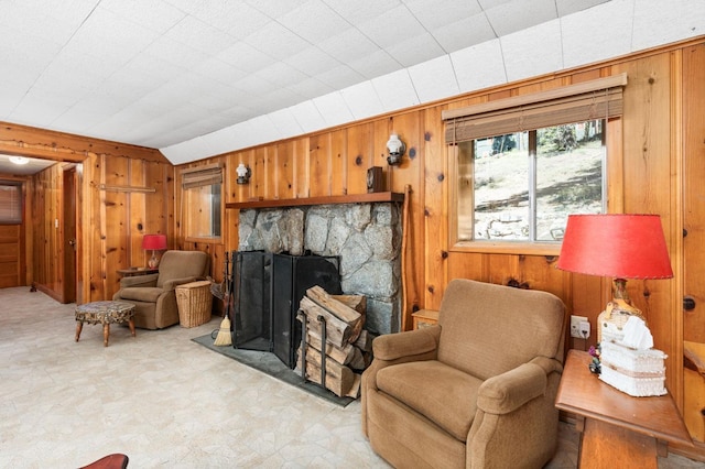 58374 Huntington Lake Rd Unit 12, Lakeshore, CA 93634 - living area with wood walls, light floors, and a stone fireplace