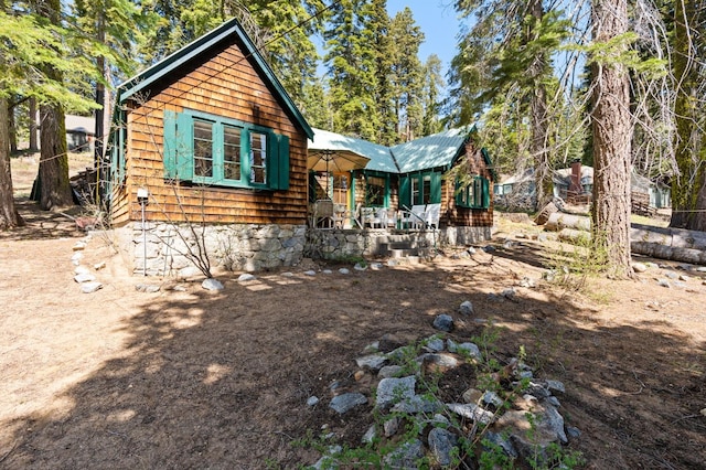 58374 Huntington Lake Rd Unit 12, Lakeshore, CA 93634 - view of front facade featuring covered porch and metal roof