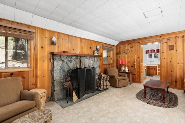 58374 Huntington Lake Rd Unit 12, Lakeshore, CA 93634 - living room featuring wood walls, tile patterned floors, and a fireplace