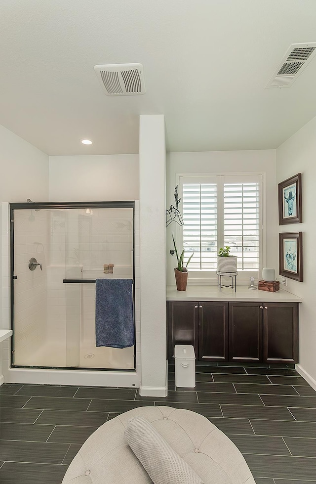 7005 N Astoria Ave, Fresno, CA 93722 - full bathroom with a stall shower, wood tiled floors, baseboards, and recessed lighting