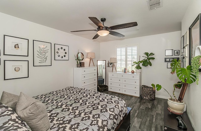 7005 N Astoria Ave, Fresno, CA 93722 - bedroom with dark wood-style flooring, baseboards, and ceiling fan
