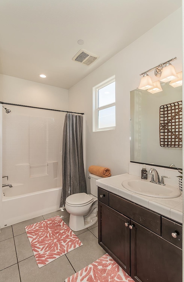 7005 N Astoria Ave, Fresno, CA 93722 - full bathroom featuring toilet, shower / bathtub combination with curtain, vanity, and tile patterned flooring