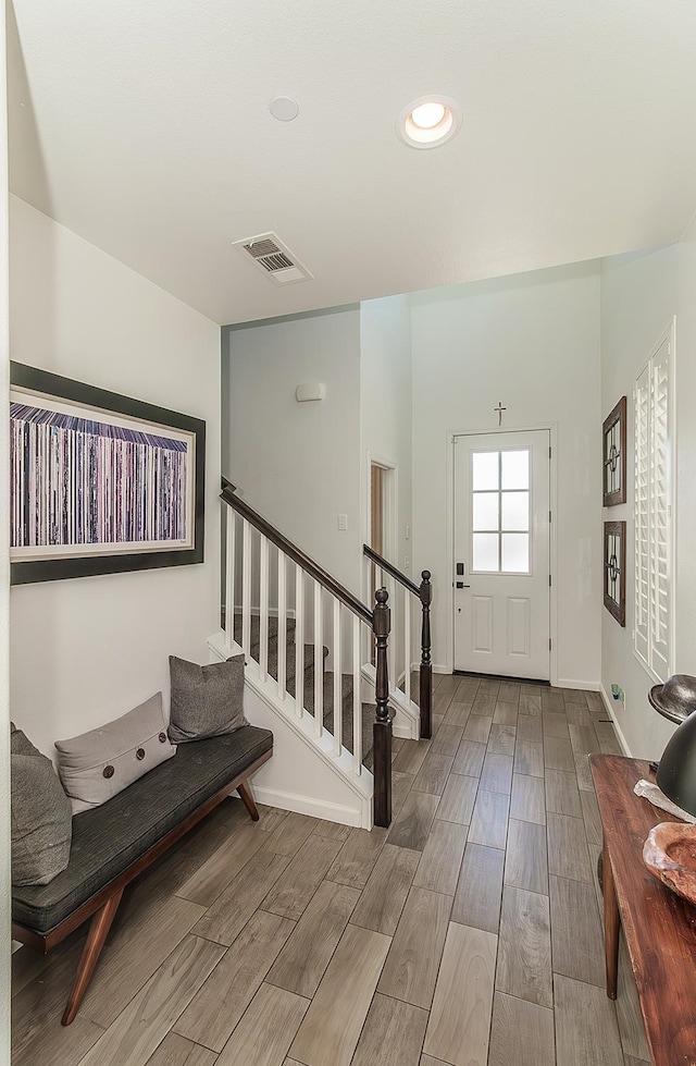 7005 N Astoria Ave, Fresno, CA 93722 - entrance foyer featuring wood finished floors, stairs, and baseboards