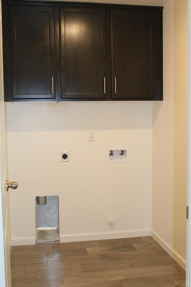 2158 W Ambassador Way, Hanford, CA 93230 - clothes washing area featuring hookup for an electric dryer, washer hookup, wood finished floors, cabinet space, and baseboards