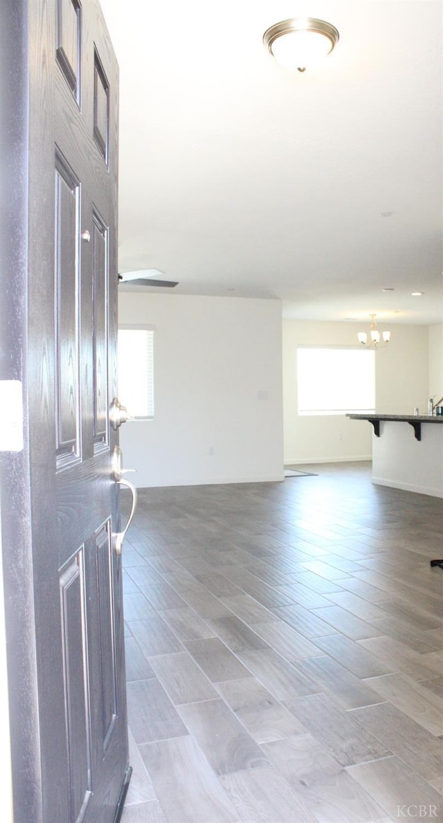 2158 W Ambassador Way, Hanford, CA 93230 - foyer entrance featuring plenty of natural light, a chandelier, and light wood-style flooring
