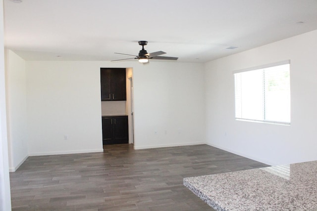 2158 W Ambassador Way, Hanford, CA 93230 - empty room featuring wood finished floors, ceiling fan, and baseboards