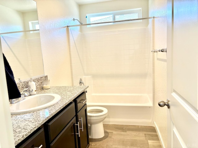 2158 W Ambassador Way, Hanford, CA 93230 - full bathroom with toilet, wood finished floors, shower / washtub combination, vanity, and a textured wall
