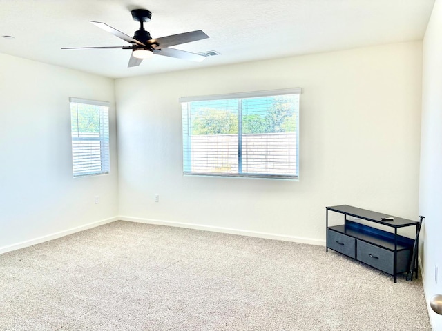 2158 W Ambassador Way, Hanford, CA 93230 - carpeted spare room featuring a ceiling fan and baseboards