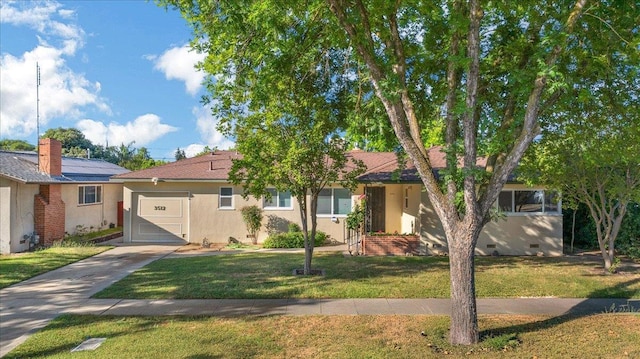 3512 E Simpson Ave, Fresno, CA 93703 - ranch-style house featuring an attached garage, driveway, a front yard, and stucco siding