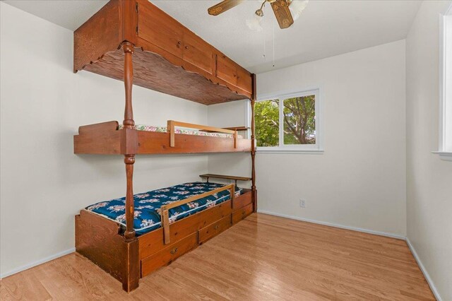 3512 E Simpson Ave, Fresno, CA 93703 - bedroom featuring wood finished floors and baseboards