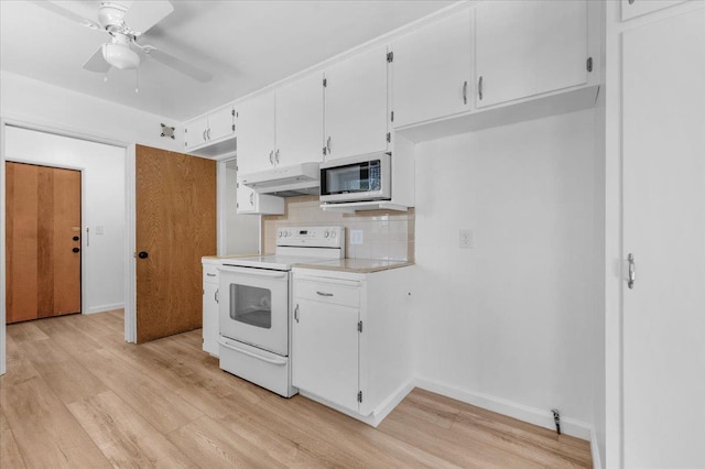 3512 E Simpson Ave, Fresno, CA 93703 - kitchen featuring white electric range oven, under cabinet range hood, light wood-style floors, and a ceiling fan