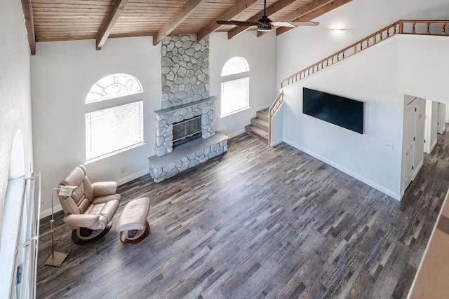 43480 Cave Stone Ct, Coarsegold, CA 93614 - unfurnished living room with a fireplace, ceiling fan, wood finished floors, baseboards, and wooden ceiling