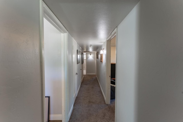 1428 E Simpson, Fresno, CA 93704 - corridor featuring light carpet, baseboards, and a textured wall