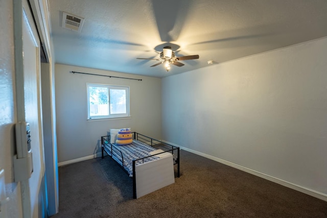1428 E Simpson, Fresno, CA 93704 - bedroom featuring baseboards, dark colored carpet, and a ceiling fan