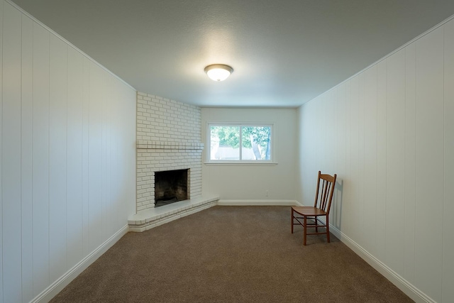 1428 E Simpson, Fresno, CA 93704 - unfurnished room with a brick fireplace and dark carpet