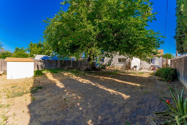 1428 E Simpson, Fresno, CA 93704 - fenced backyard with a shed and an outdoor structure