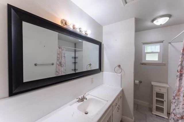 1428 E Simpson, Fresno, CA 93704 - full bath with vanity, tile patterned floors, baseboards, and curtained shower