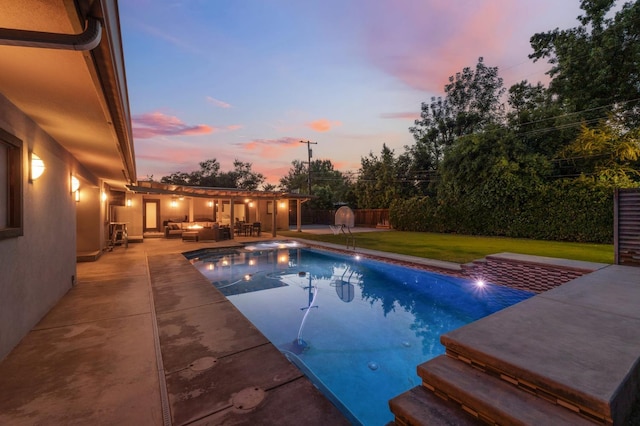 1478 W Dovewood Ln, Fresno, CA 93711 - pool at dusk with an outdoor hangout area, a patio, a fenced backyard, and a hot tub