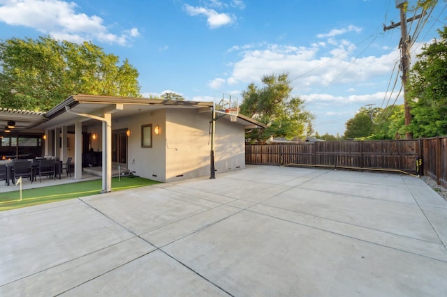 1478 W Dovewood Ln, Fresno, CA 93711 - view of property exterior featuring crawl space, fence, a patio, and stucco siding