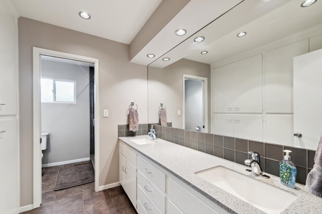 1478 W Dovewood Ln, Fresno, CA 93711 - full bathroom with recessed lighting, decorative backsplash, double vanity, baseboards, and tile patterned flooring