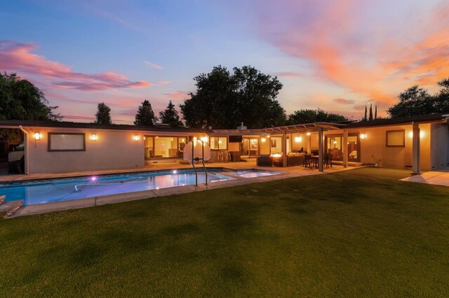 1478 W Dovewood Ln, Fresno, CA 93711 - pool at dusk featuring a lawn, an outdoor pool, and a patio
