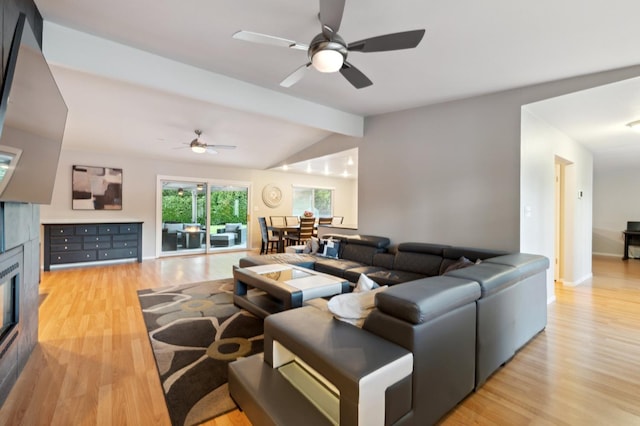 1478 W Dovewood Ln, Fresno, CA 93711 - living area with light wood-style floors, a ceiling fan, a tile fireplace, and baseboards