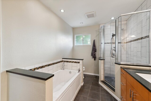 1478 W Dovewood Ln, Fresno, CA 93711 - full bathroom featuring a shower stall, toilet, tile patterned floors, a bath, and vanity