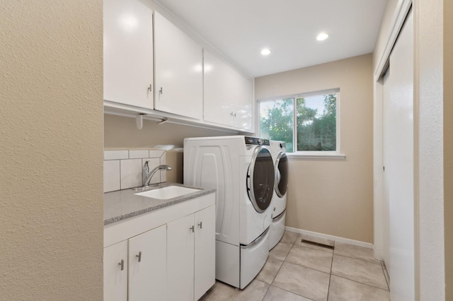 1478 W Dovewood Ln, Fresno, CA 93711 - laundry area featuring separate washer and dryer, cabinet space, light tile patterned flooring, baseboards, and recessed lighting