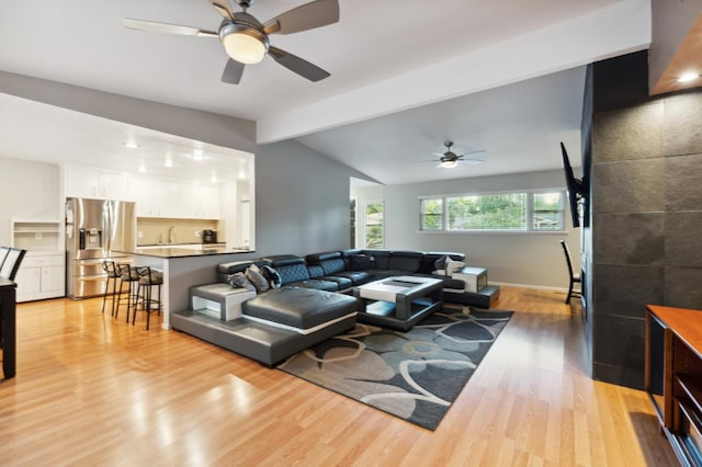 1478 W Dovewood Ln, Fresno, CA 93711 - living area with light wood finished floors, a ceiling fan, and baseboards