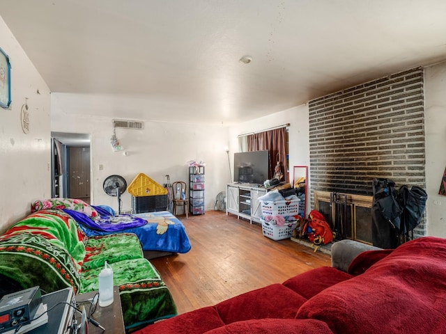 2972 E Northdale Ave, Fresno, CA 93726 - living room with hardwood / wood-style floors and a brick fireplace