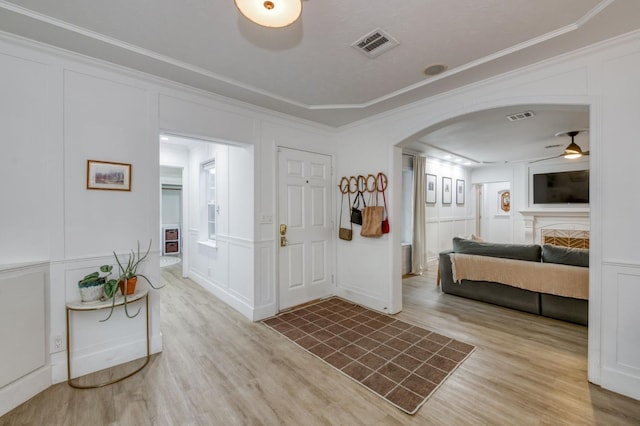 3519 N Van Ness Blvd, Fresno, CA 93704 - entryway featuring a decorative wall, arched walkways, wood finished floors, ornamental molding, and a ceiling fan